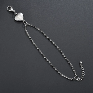 Silver stainless steel bracelet with heart-shaped Our Lady of Guadalupe religious pendant