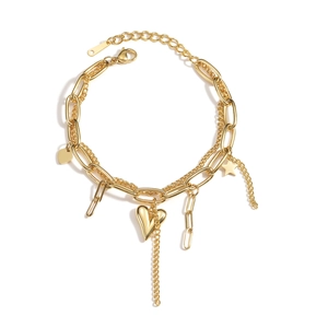 Golden double-layer bracelet with heart and star charms on a white background