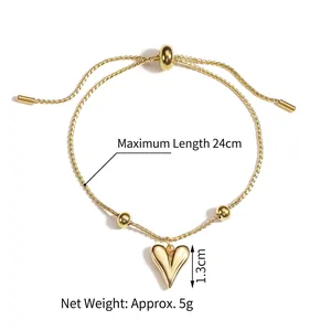 Minimalist gold heart bracelet with adjustable sliding closure on a white background
