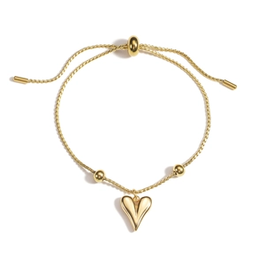 Adjustable gold double-layer heart charm bracelet with polished beads on white background