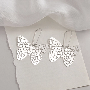 Elegant hollow butterfly drop earrings in silver stainless steel with long hook design
