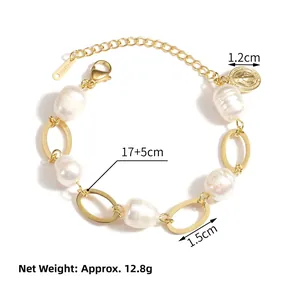 Detail of stainless steel pearl bracelet with lobster clasp and holy icon coin pendant