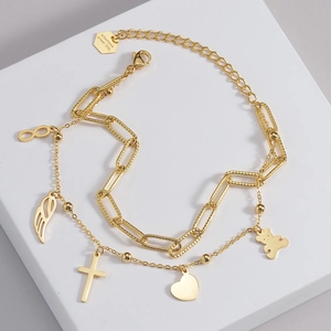 Detail of 316L stainless steel double layer gold bracelet with bear and heart charms