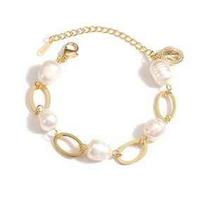 Detailed macro view of double-layer stainless steel bracelet with pearls and coin pendant