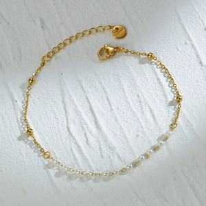 Minimalist gold stainless steel pearl bracelet with round beads and adjustable clasp
