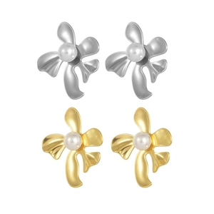 Elegant gold and silver flower stud earrings with pearl centers on a plain white background