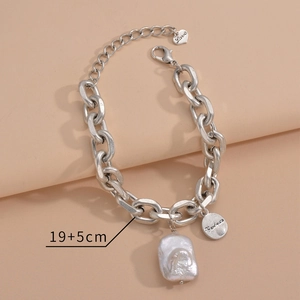 Vintage silver chunky chain bracelet featuring baroque pearl, heart and coin charms