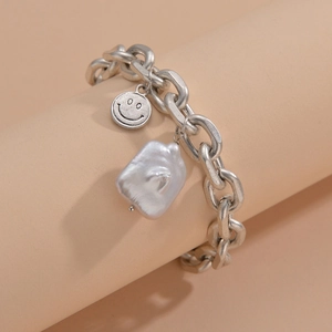 Minimalist silver matte chain bracelet with a smiley face charm and baroque pearl