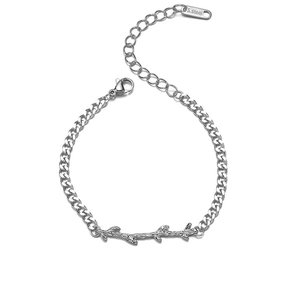 Detail of stainless steel cuban chain bracelet featuring a unique thorn design and lobster clasp