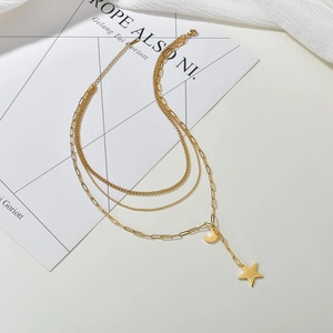 Layered gold stainless steel necklace with paperclip chain and star moon pendants