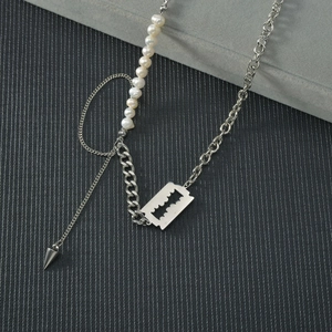 Minimalist pearl and stainless steel chain necklace with edgy punk blade and spike charms