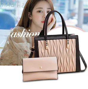 Detailed view of pink quilted tote bag and matching long wallet with elegant pleats