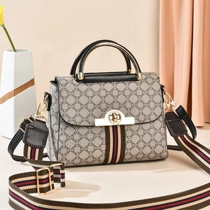 Elegant beige crossbody bag with grey geometric patterns and colorful striped strap