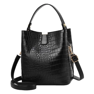 Elegant black crocodile embossed bucket bag with gold hardware and adjustable strap
