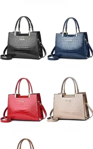 Detailed grid of four alligator texture crossbody bags in black, blue, red and khaki
