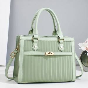 Structured mint green striped tote bag with gold hardware and removable shoulder strap