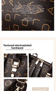Detail of dark brown PU leather with gold letter pattern and polished metal hardware