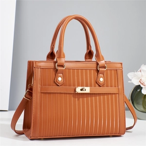 Brown striped handbag with golden hardware and adjustable shoulder strap for women