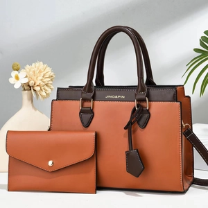 Zweiteiliges Handtaschen-Set in Kontrastfarben mit Tragetasche und Clutch aus PU-Leder