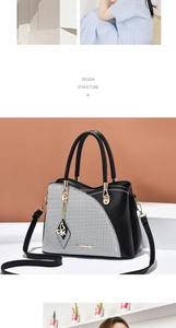 Detail of houndstitch patchwork tote with golden hardware and butterfly pendant accessory