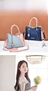 Detail of color-block tote bags with metal brand logo and butterfly charm accents