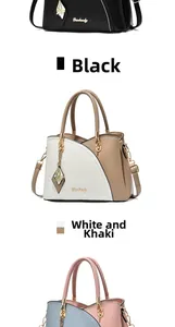 Detail view of large tote bag with butterfly charm and Dunbaoly metallic logo lettering