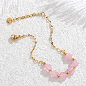 Elegant gold stainless steel star bracelet with pink cat eye beads and lobster clasp