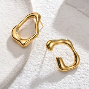 Modern minimalist irregular gold-plated stainless steel earrings on a textured stone surface