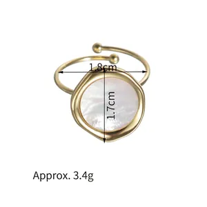 14K gold plated stainless steel ring with irregular shell inlay on white background