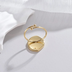 Detailed close-up of 14K gold plated irregular round ring with minimalist metal base
