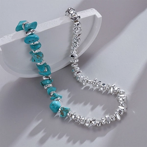 Ethnic stainless steel necklace with irregular turquoise beads on white stone decor