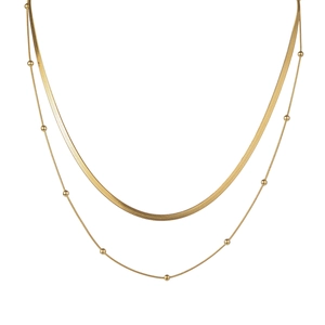 Minimalist double layer gold necklace featuring a flat herringbone chain and bead accents