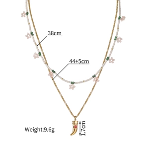 Collier double rang en acier inoxydable avec perles roses et pendentif corne rubis
