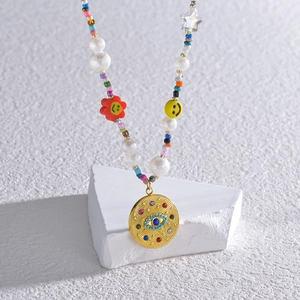 Collier bohème perles colorées avec smileys et pendentif oeil maléfique doré