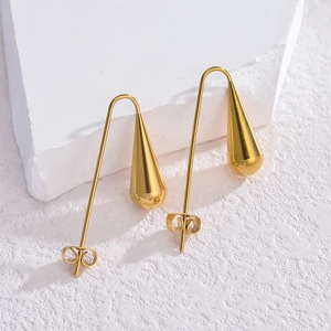 Boucles d'oreilles gouttes élégantes en acier inoxydable doré sur socle en pierre
