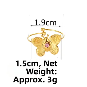 Detail of adjustable gold butterfly ring with pink zircon stone and dimension markings