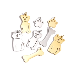 Set of cute stainless steel pet charms featuring cat, dog, paw, and bone shapes in gold and silver