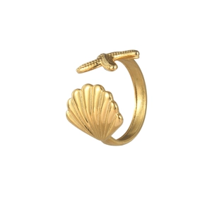 Detailed shot of open stainless steel ring with golden starfish and scallop shell charms