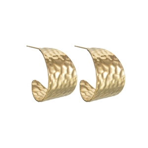 Detail of gold geometric C-shaped earrings with hand-hammered texture finish