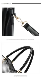 Detail of black pebbled leather tote featuring gold metal hooks and side plaid accents