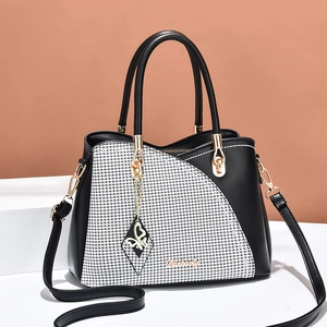 Chic black and houndstooth large tote bag with gold chain butterfly charm for women