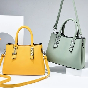 Minimalist tote bags in yellow and sage green with silver chain and detachable straps