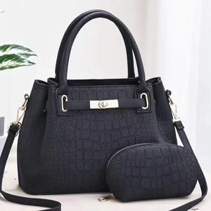 Black crocodile embossed tote bag and pouch set with gold hardware and shoulder strap