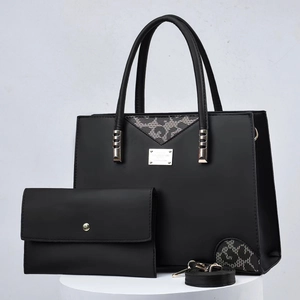 Two-piece black PU leather handbag set with leopard print fabric and golden hardware