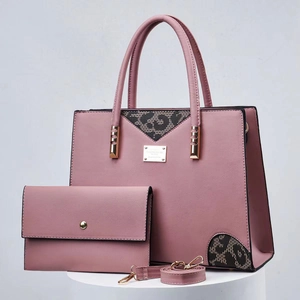 Close-up of pink leopard patchwork tote bag with matching wallet and golden hardware