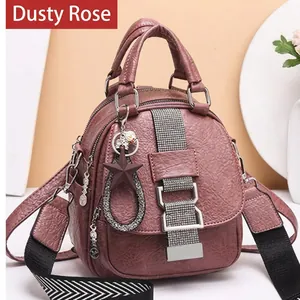 Chic muted pink PU leather backpack for women with sparkling ribbon details and star charm