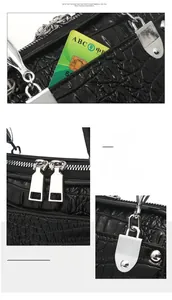 Details von Krokodil-Prägung und silbernen Beschlägen an einer schwarzen Handtasche
