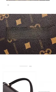 Detail of vintage brown leather bag featuring textured print and black leather handle