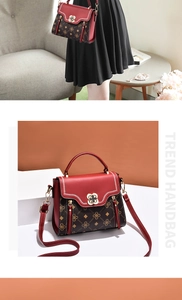 Detail of red and brown monogram handbag featuring a gold flower twist lock and strap