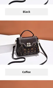 Detail view of coffee monogram handbag with wave stitching and gold floral buckle